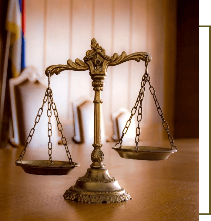 A close up of the scales of justice on top of a table